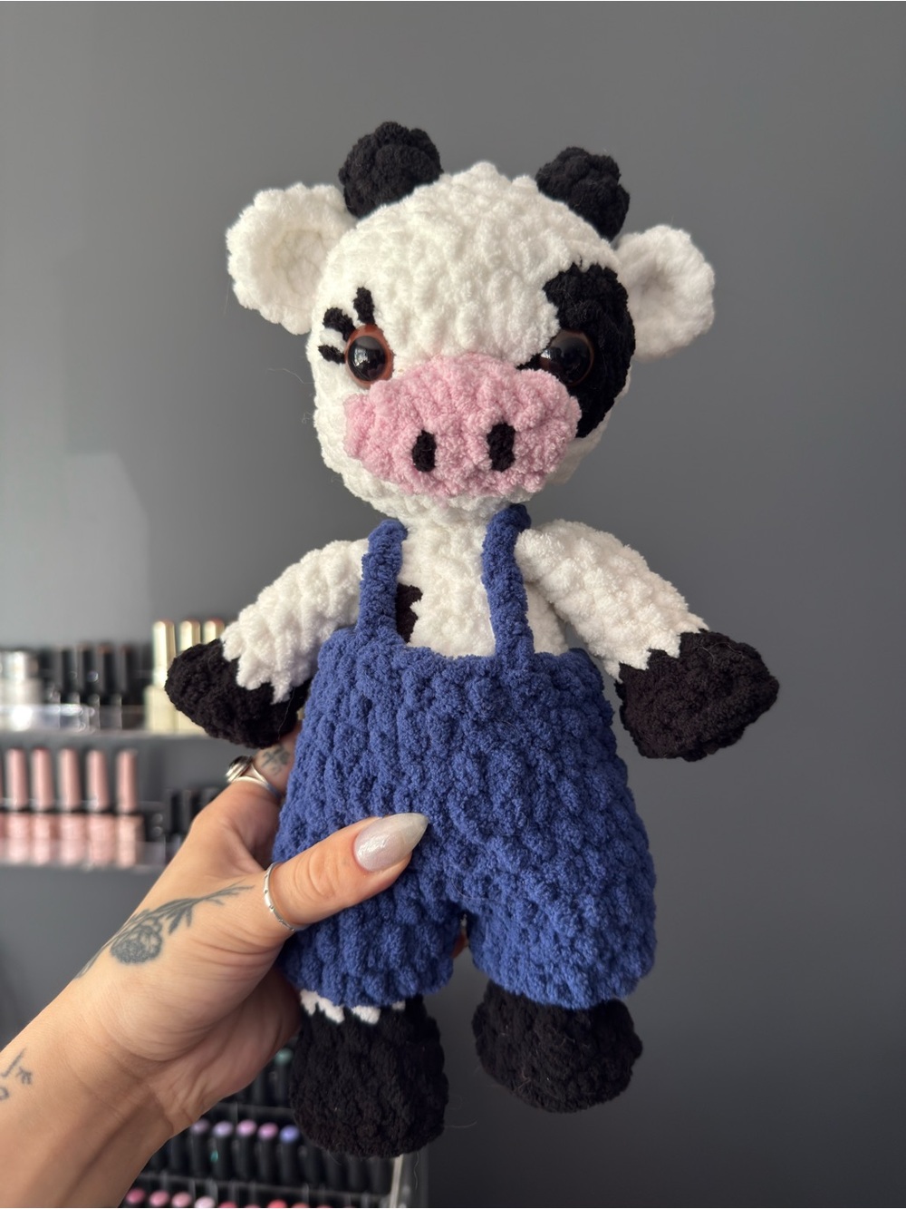 crocheted cow in overalls